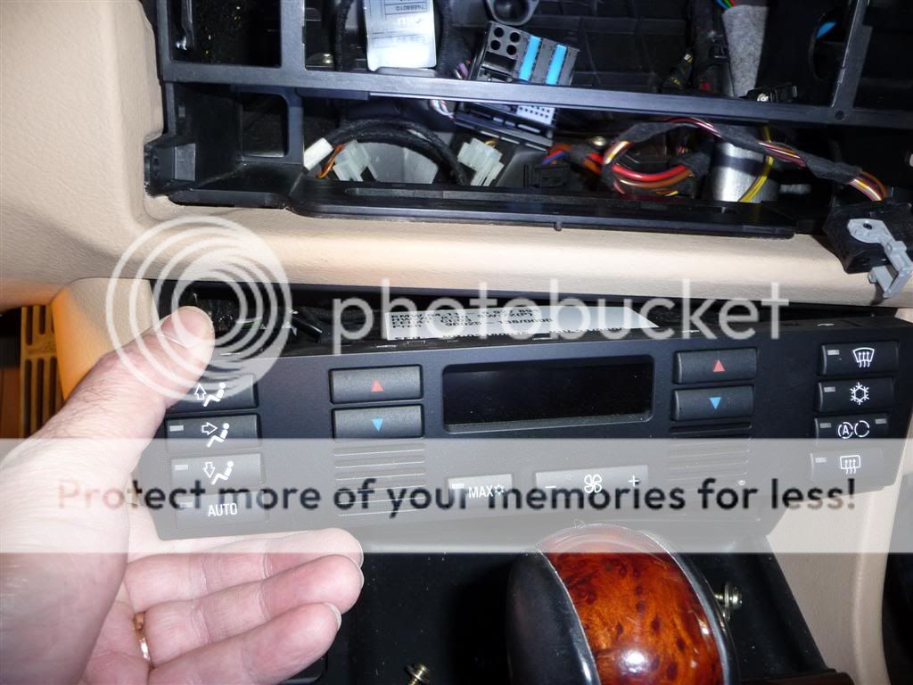 Now pull out the Climate control unit. It is pressure hold in, so just push from behind: